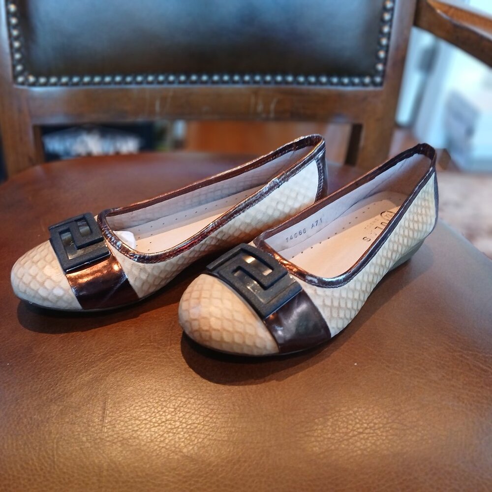 Low leather flats in a camel color.